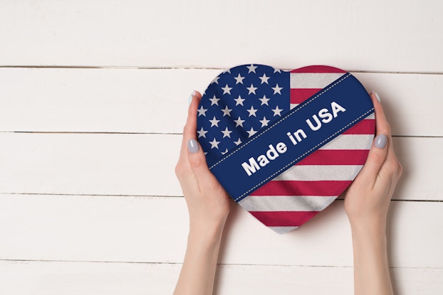  hands holding american flag heart