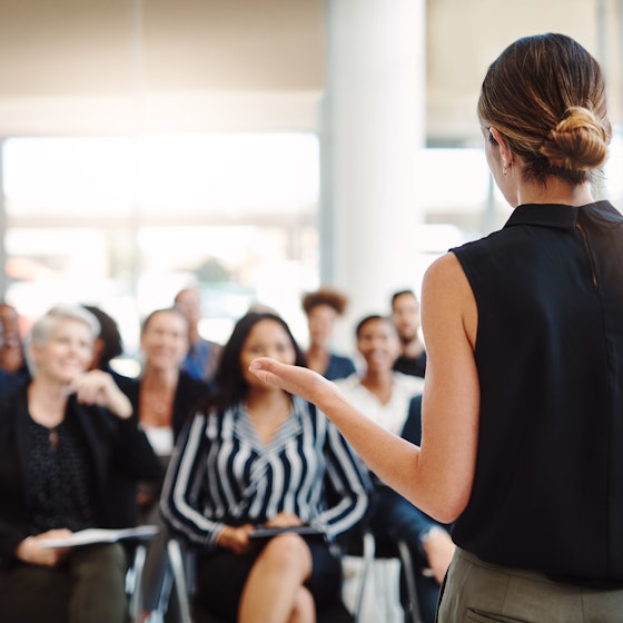 professional woman giving presentation