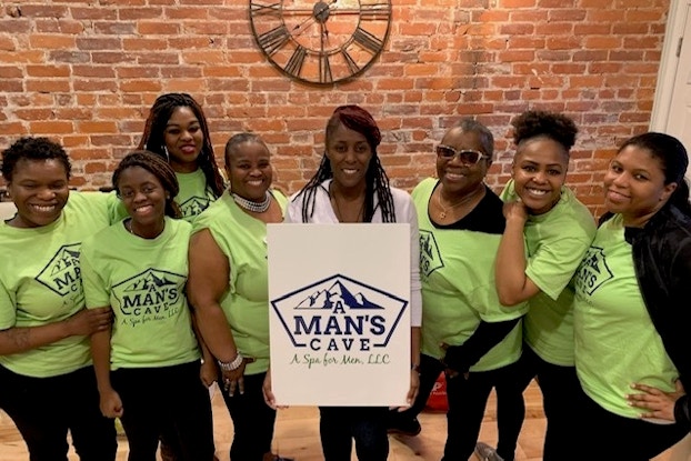 team of employees at A Man’s Cave-A Spa for Men, LLC