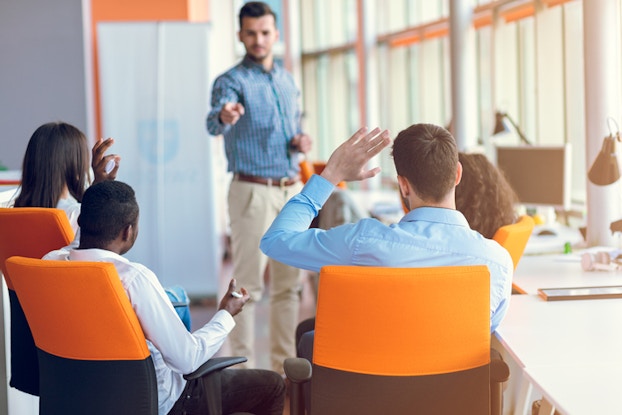  employees in a meeting