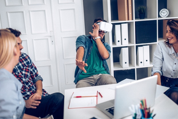 group of young professionals testing a VR headset