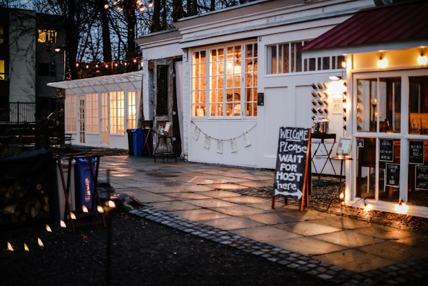 The Argos Inn outdoor bar at night with bistro lighting.