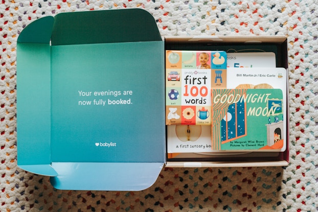 Open box from Babylist with various baby items, including books.