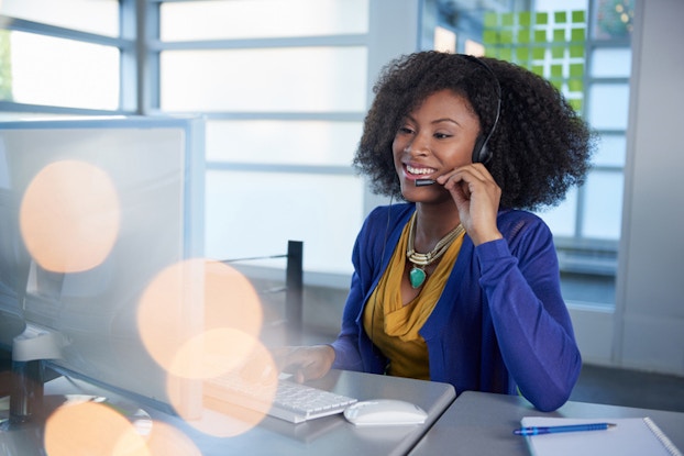 Woman talking on head set