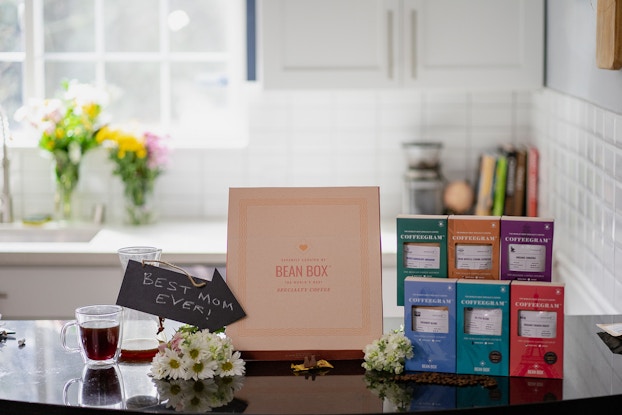 Product display by Bean Box on a kitchen countertop showing the Mother's Day-themed Coffeegram collection.