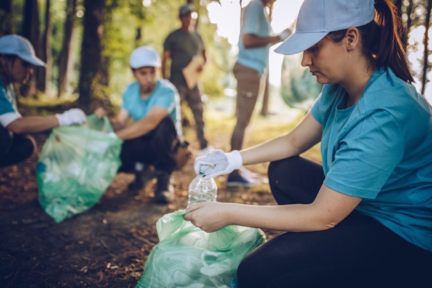  People working together to clean up the environment