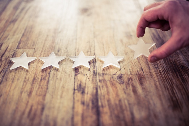 Five stars on wooden table