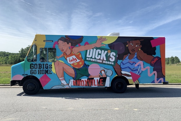 Truck showing Dick's Sporting Goods female empowerment campaign.