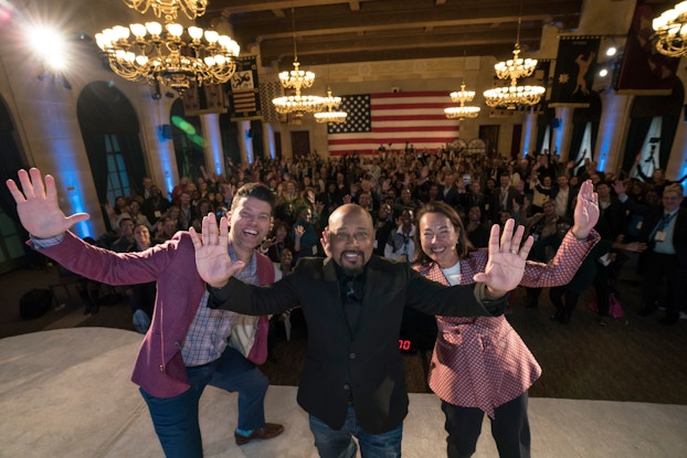  daymond john taking selfie with a crowd