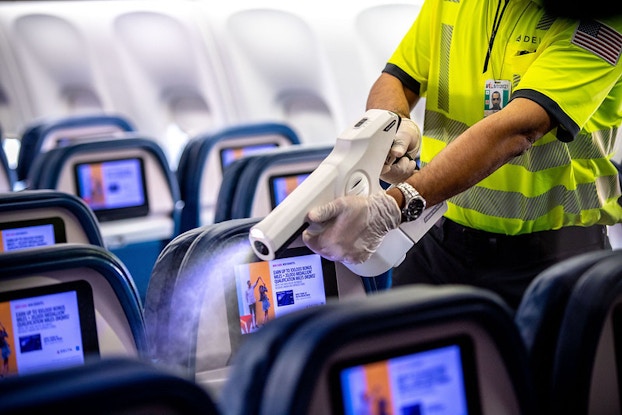  worker on delta plane using sanitizer machine