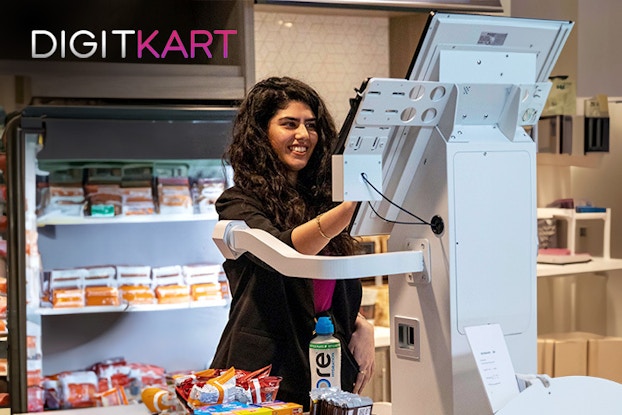 Woman using a Digit7 machine in a store.