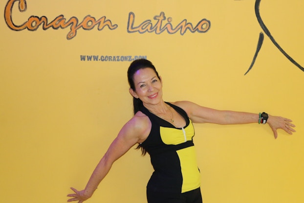 Fanny Gonzalez at studio entrance.