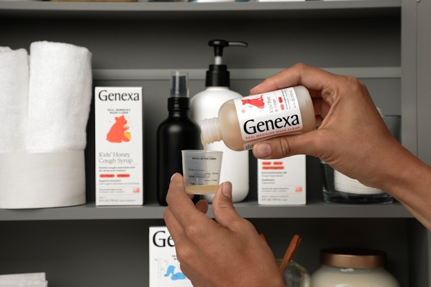 Person pouring medicine from a Genexa bottle with their medicine cabinet in the background.