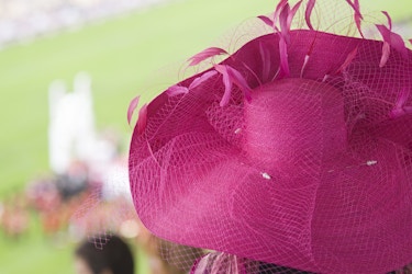  Large women's bright pink hat with feathers worn at horse races. 
