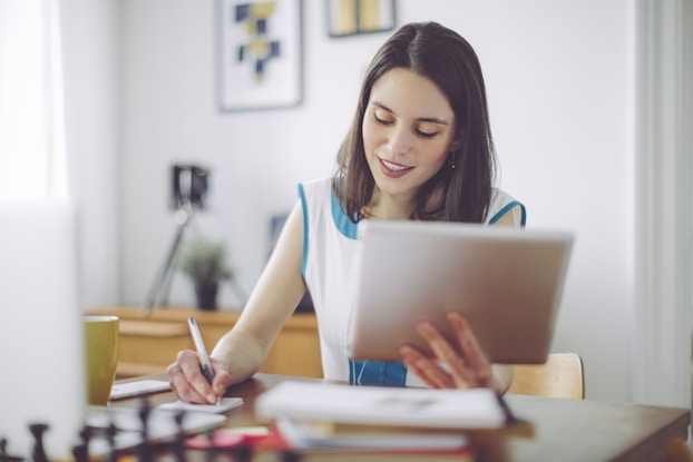 A young woman works remotely.
