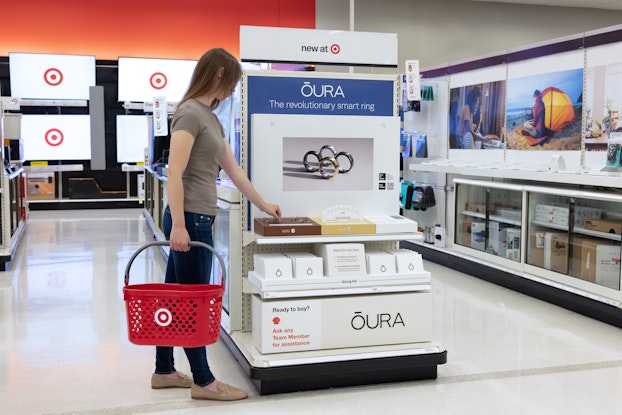 Person shopping at the Oura display in Target.
