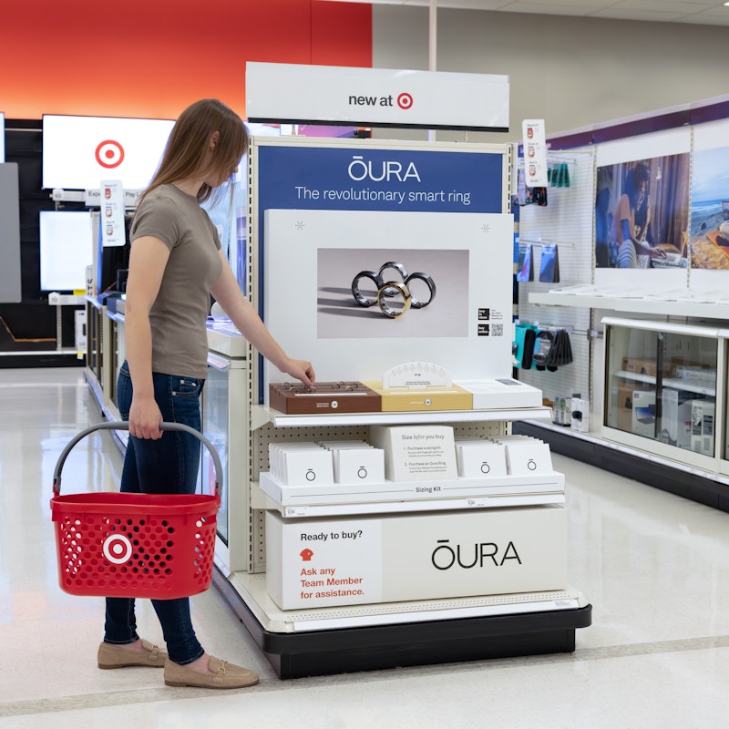Person shopping at the Oura display in Target.