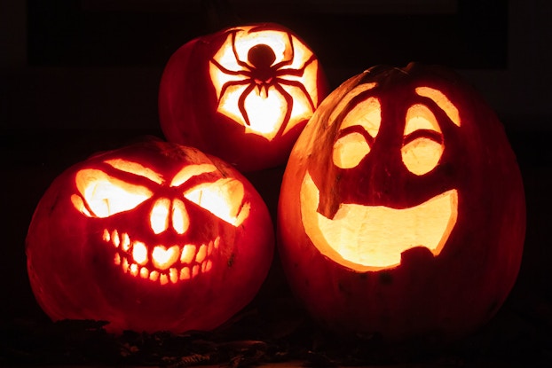  Night shot of illuminated pumpkins.