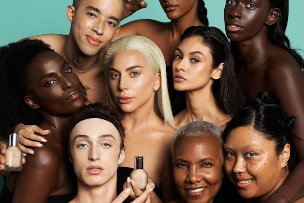 Lady Gaga surrounded by a group of diverse models wearing makeup by Haus Labs.