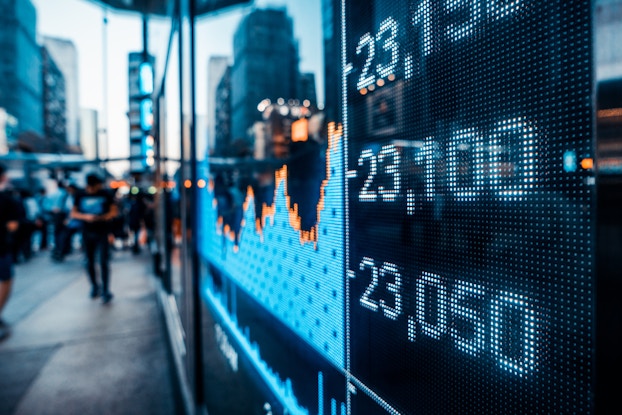  Image of stocks on digital board on the street