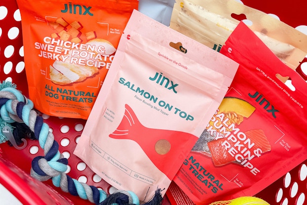 JINX dog food bags with dog toys in a Target shopper.