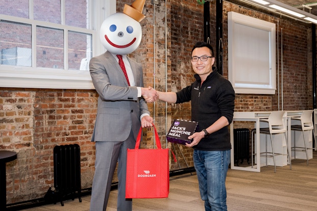  Jack in the Box with Door Dash co-founder and CEO Tony Xu. Jack in the Box uses text messaging to drive delivery orders via Door Dash.