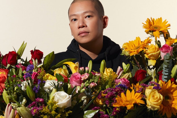  Fashion designer Jason Wu posing with flowers from 1-800-Flowers.