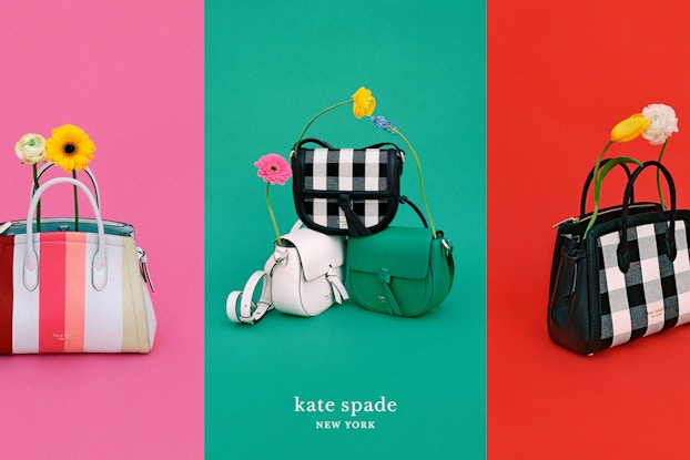  Colorful Kate Spade New York product display with pocketbooks and flowers.