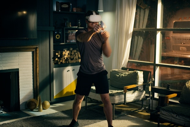  Person using a VR headset for online boxing workout platform Liteboxer.