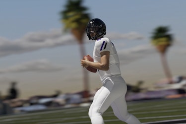 Image of C.J. Stroud in uniform holding a football, from Lockerverse.