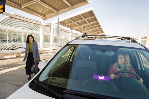 woman getting picked up by lyft