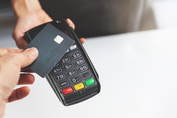  Customer taps chip-enabled credit card to a POS device.