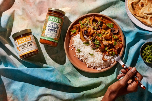Food display photo of Brooklyn Delhi's Mushroom Matar on a table.