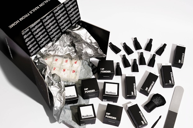  Product display by Nailboo, showing an open box with product in black-and-white packaging.