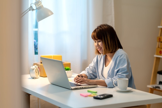  woman working on laptop at home