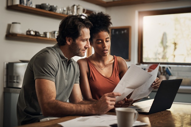  Workers consulting on documents