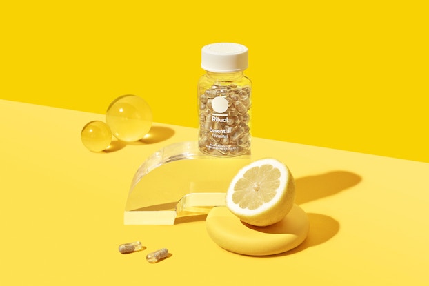 product display of ritual vitamins with yellow backgound