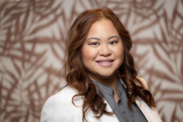 Headshot of Genevieve Santos-Bann, Founder of 360 Beauty Maven Consulting.