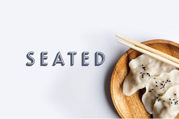 image of seated logo with dumplings on a plate