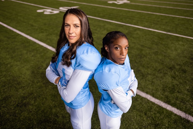  two women dressed up as football players