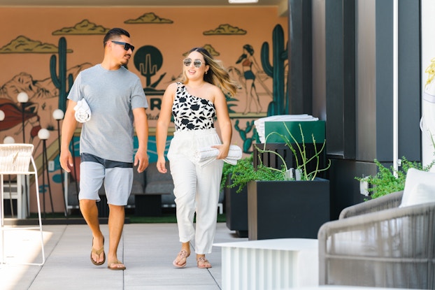  Two guests walking through Senna House hotel in Arizona.