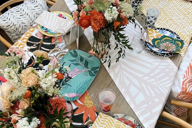 Image of a custom design event created by Shutterfly: a tablescape with plates, runners, and napkins with various designs.