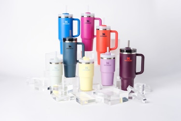  Colorful assortment of Stanley Quencher water bottles. 