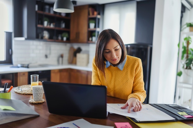  Young business entrepreneur woman working at home