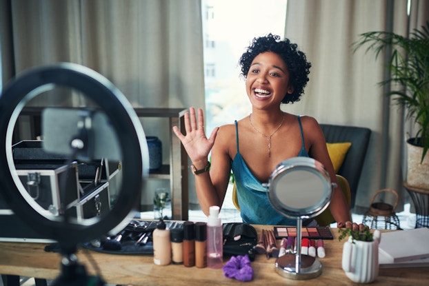 An entrepreneur recording a video for her business.