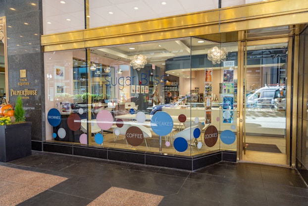 Storefront of a Sugar Bliss bakery location.