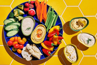  Vegetable platter and dip display with dishware from the Tabitha Brown for Target line. 