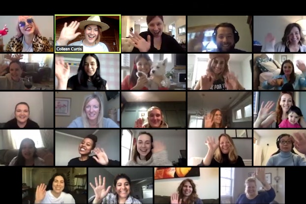  Smiling women participate in a virtual meeting