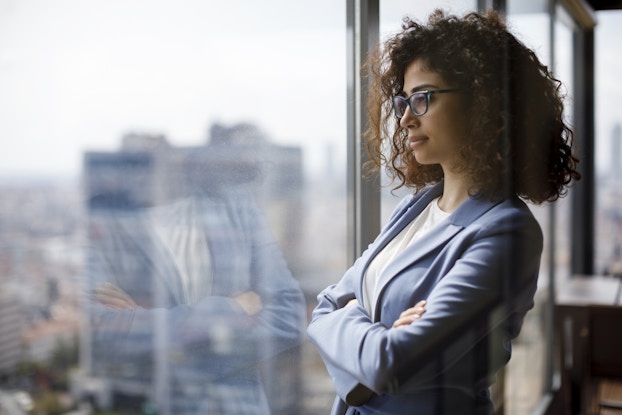 Pensive business woman thinks about promotion
