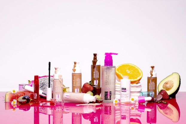 Product display of UOMA Beauty cosmetics.